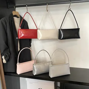 Minimalist rectangular underarm bags in six colors with glossy leather texture and thin strap
