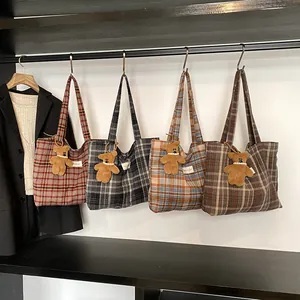 Retro plaid tote bags in four colors with plush bear charms for autumn commute