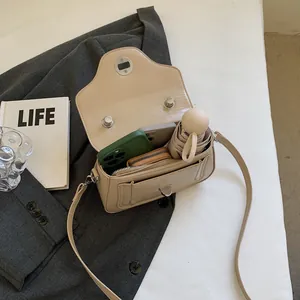Chic cream PU leather crossbody bag showing internal capacity for phone and umbrella