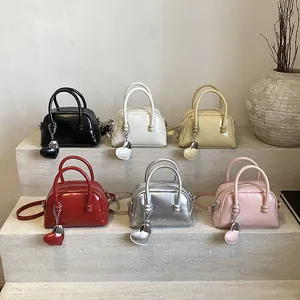 Retro Boston handbag collection in diverse candy colors with a stylish heart charm