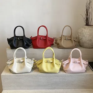 Minimalist leather shoulder bag with chic side wings and double top handles in multi colors