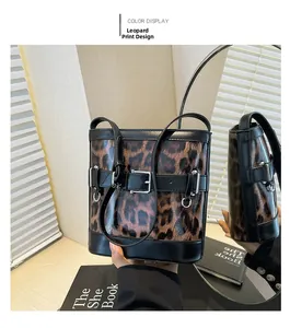 Detail of leopard print bucket bag with glossy leather trim and silver metal buckle