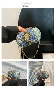 Detailed close-up of snake pattern evening bag with golden metal frame and chain strap