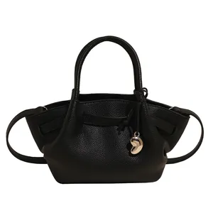 Retro black lychee grain leather tote bag with wing sides and silver heart pendant
