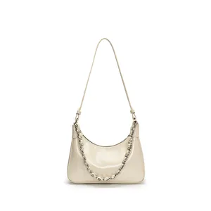 Minimalist cream white crescent hobo bag with glossy finish and silver chain strap