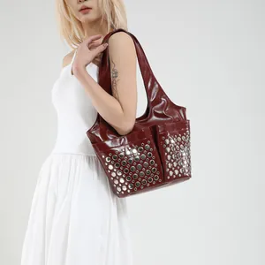 Vintage punk style wine red leather tote bag with silver studs and side pockets