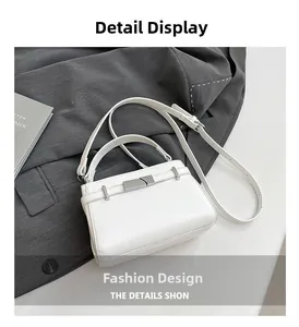 Detailed shot of white lychee leather texture with silver buckle and thin strap
