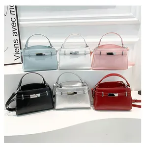 Collection of minimalist leather handbags in six vibrant colors with metal buckle closure