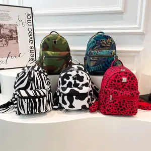 Mini sacs à dos avec motifs zèbre, vache et camouflage sur un support blanc pour femme