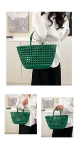 Close-up of green woven jelly tote bag with cutout design and integrated handles