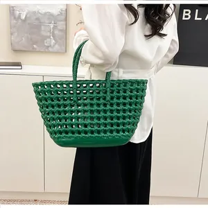 Detail of green woven jelly bag showing the hollow-out pattern and flexible texture