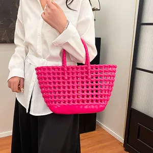 Fuchsia woven jelly bag with a hollow design and large capacity for stylish summer carry