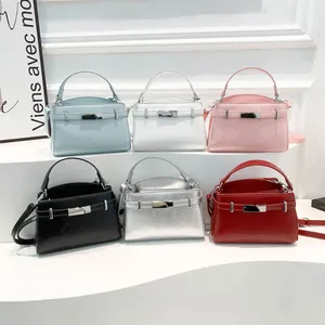 Chic trapezoid crossbody bag in various colors with metallic buckle and leather texture
