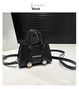 Detail of black leather mini tote with silver metal feet and Fashion & Bags text logo