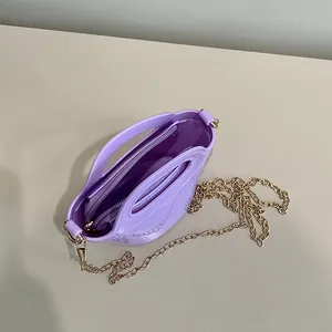 Fashionable lavender silicone jelly bag with embossed patterns and gold chain strap