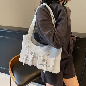 Gray-blue faux leather crossbody shoulder bag with silver chains and heart pendant