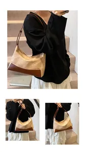 Detail of vintage beige and brown patchwork shoulder bag featuring crinkled texture