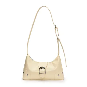 Cream crescent shoulder bag in textured faux leather with silver horseshoe buckle detail