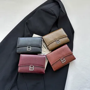 Retro faux leather trifold wallet set in black, green, and burgundy with metal B logo