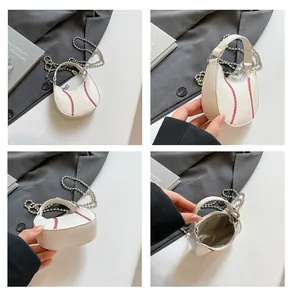 Detail view of mini baseball purse with red stitching and silver chain strap