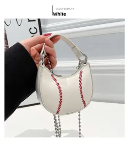 Detailed view of white mini dumpling bag with red baseball stitching and silver chain