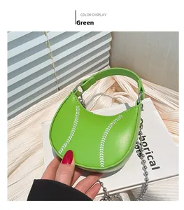 Detailed close-up of green baseball-style mini bag with V-shaped stitching and chain strap