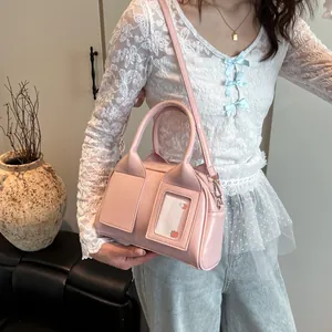 Pink glossy shoulder bag with transparent card slot and silver metallic hardware