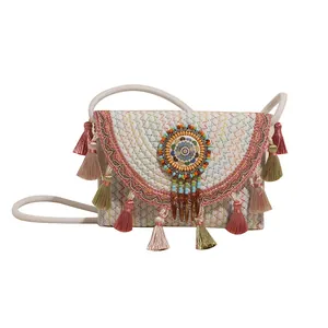 Bohemian woven crossbody bag with colorful embroidery and tassel fringe charms
