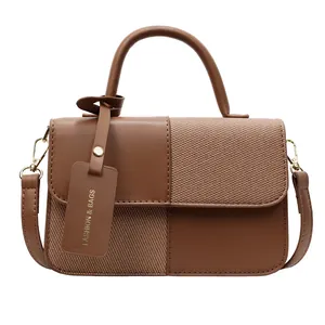 Brown color-block handbag in smooth PU leather and twill fabric with gold hardware