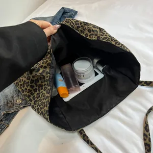Spacious leopard print canvas tote bag showing large interior capacity for daily essentials