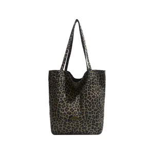 Leopard print canvas tote bag with large capacity and bronze metal logo detail