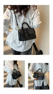 Dettaglio borsa in pelle nera con finiture dorate e targhetta fashion indossata dal modello
