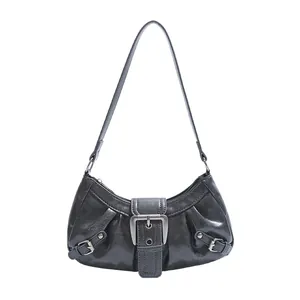 Retro black faux leather shoulder bag with vintage buckle and rivet detail on white background