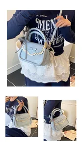 Detail of light blue leather bag featuring lace trim, bow, and checkered ribbon accents