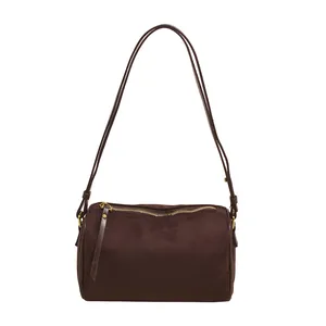 Vintage dark brown suede cylinder shoulder bag with minimalist leather straps