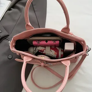 Pink lychee grain leather tote bag with large capacity interior for daily essentials