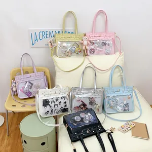 Bolsos ita grandes en siete colores con herrajes de corazón y ventana transparente frontal