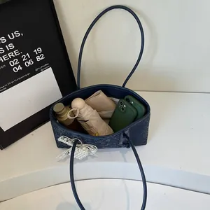 Minimalist navy blue tote bag with large capacity showing interior storage space