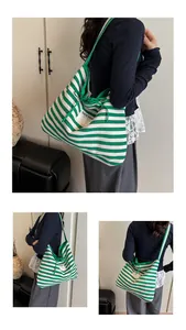 Close-up of green and white striped canvas tote bag showing the SEEYOU label and texture
