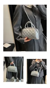 Detail showing silver quilted texture and metallic finish on the Boston crossbody bag
