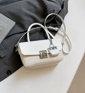 Detail showing white leather and beige woven stitching with a silver square buckle