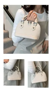 Detail view of beige shell bag featuring woven texture and versatile carrying styles