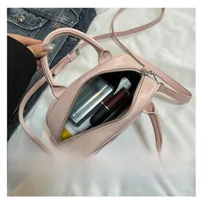 Interior view showing the storage capacity of the pink quilted Boston handbag