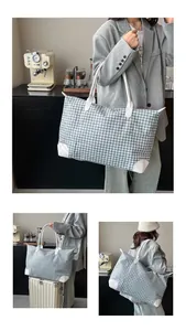 Large houndstooth travel bag with white leather handles shown in various travel settings