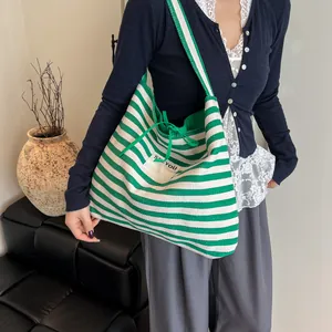 Large striped canvas tote bag in green and beige featuring SEE YOU patch detail