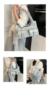 Close-up of light blue glossy patent leather tote with functional buckled pockets