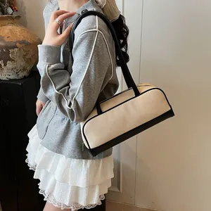 Fashionable beige canvas and black leather patchwork cylinder bowling handbag for women