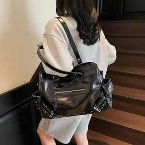 Y2K punk style black glossy leather tote bag with silver rivets and zippers