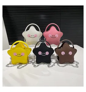 Detailed view of colorful star-shaped girl purses with cute smiley faces and chain straps
