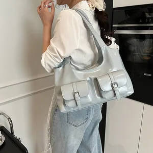 Glossy PU leather hobo bag with multiple front pockets and wide shoulder straps